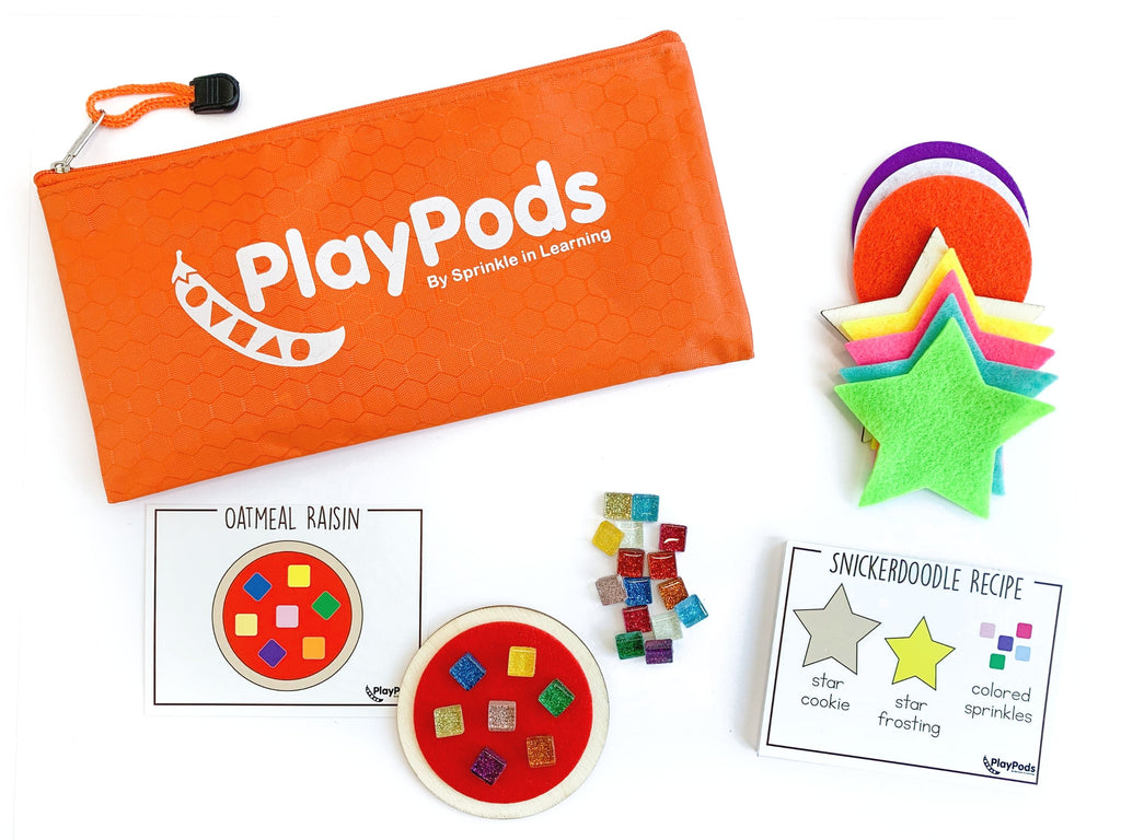 Orange PlayPod with instruction card and colorful contents