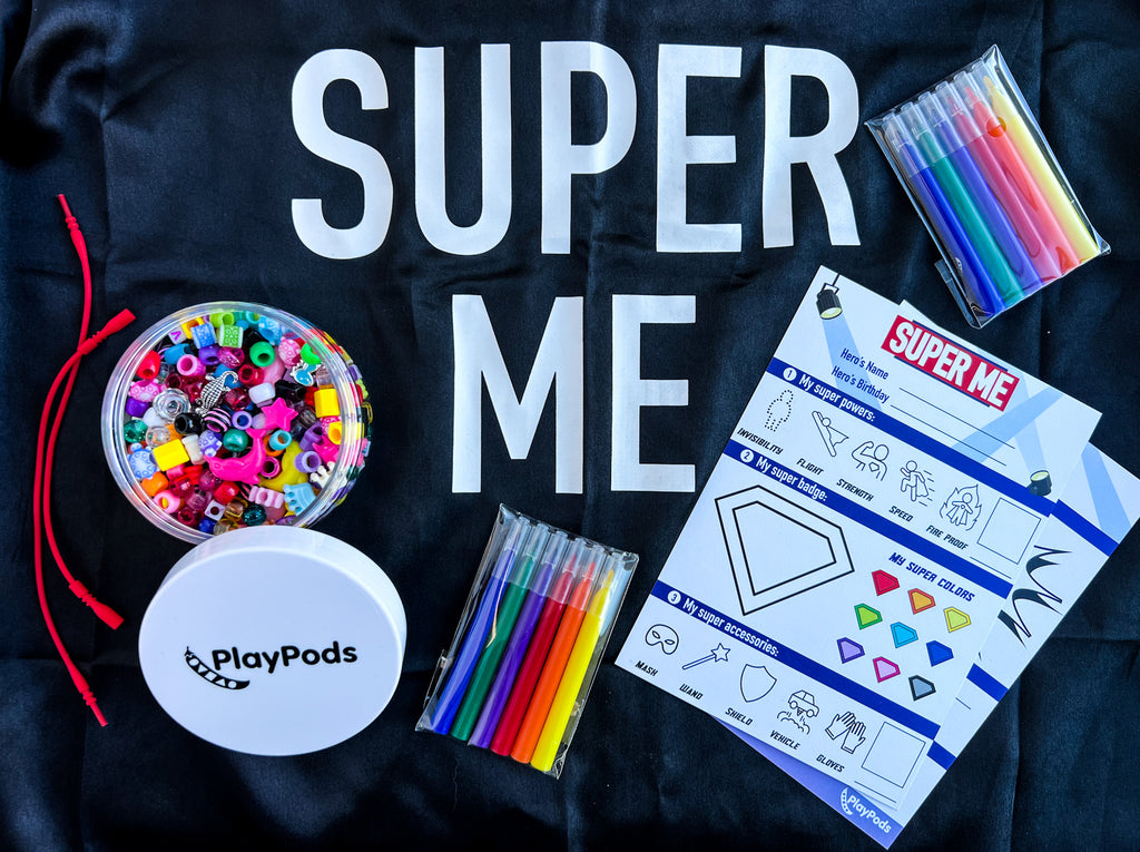 Colorful beads and markers on super me cape