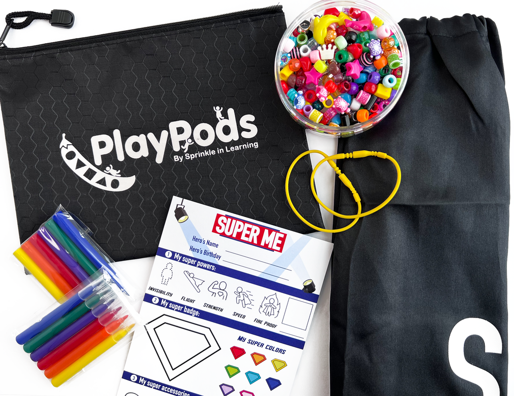 Black PlayPod pouch, black cape, colorful beads and markers