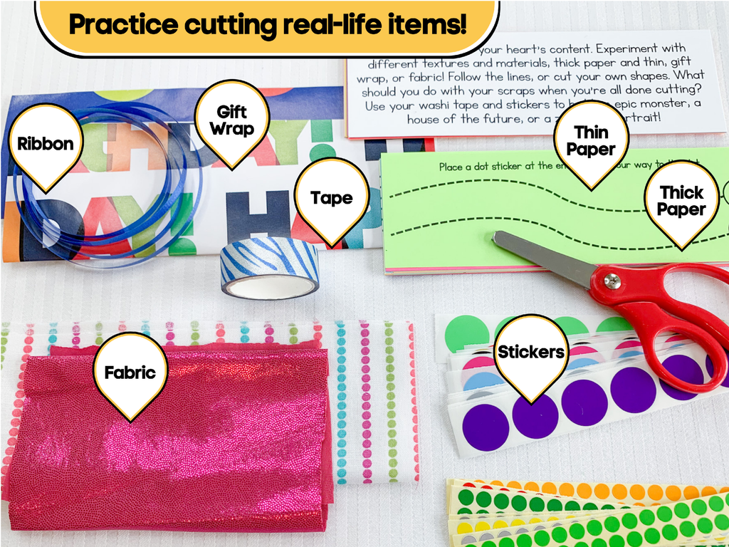 Red scissors and items to cut and decorate. Ribbon, gift wrap, tape, paper, fabric, stickers.