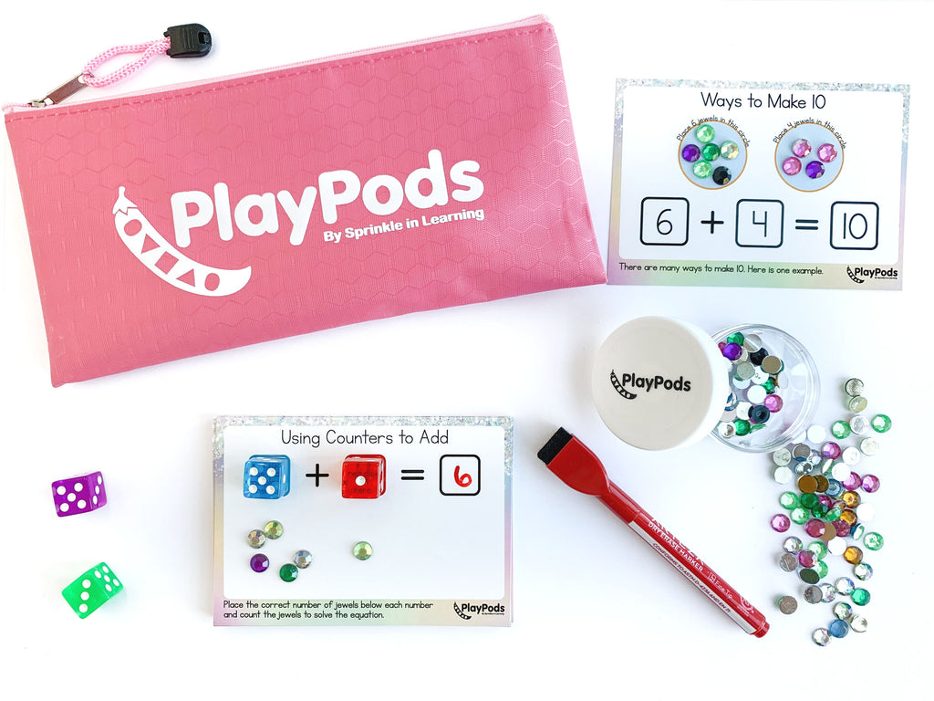 Pink PlayPod pouch, activity cards, dry erase marker, gems, and dice